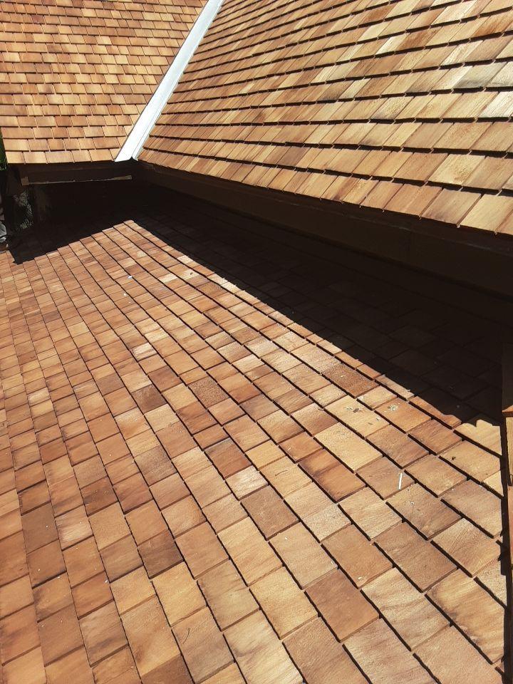 Low-slope cedar porch roof on the Sullivan House installed over waterproof membrane and Cedar Breather.