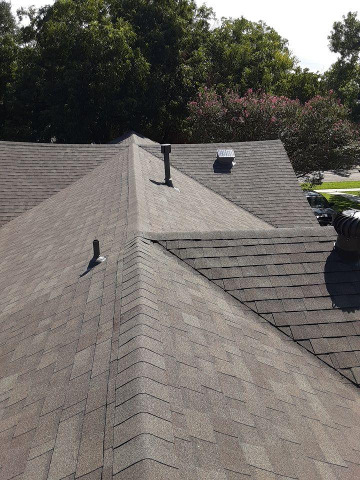 Dimensional shingle roof with multiple hips and valleys in Vickery Place Dallas 75206