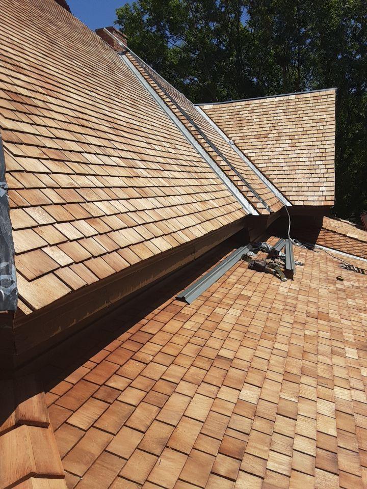 Western red cedar shingles and metal valley flashing installed on the Sullivan House roof at Old City Park in Dallas.