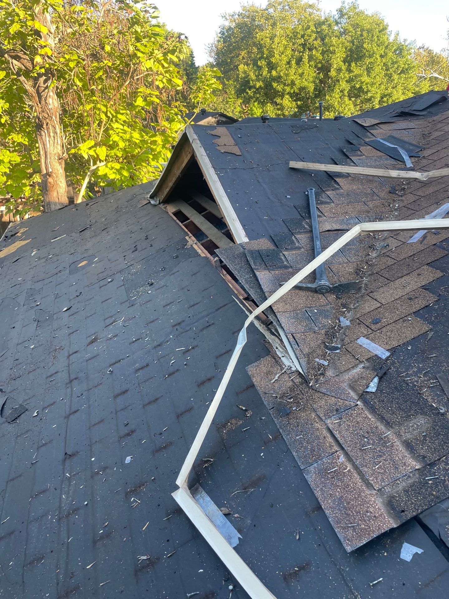 Old louvered roof ventilation dormer during roof replacement in Casa View, Dallas 75228.
