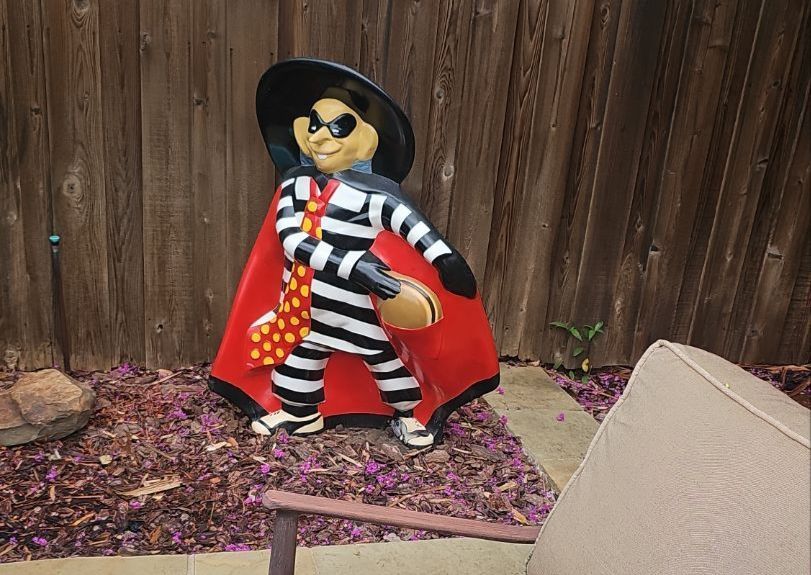 Vintage Hamburglar restaurant figure at a Richardson roofing project