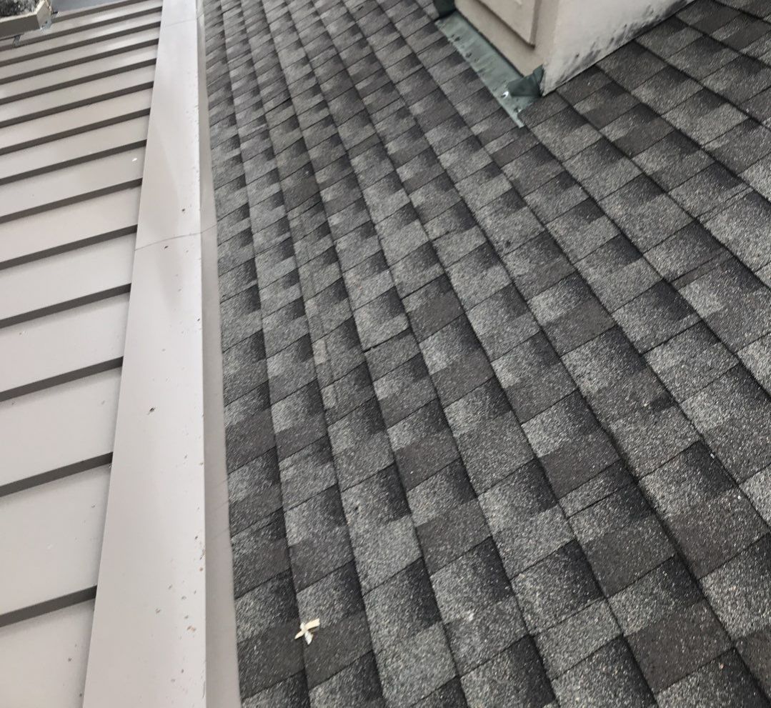 GAF Timberline HDZ roof with standing seam metal roofing in Lakewood