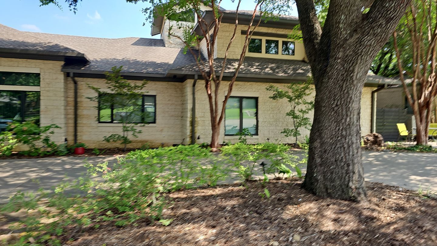 Low-slope roof transition at the bottom of a valley on a Lakewood home in Dallas 75214