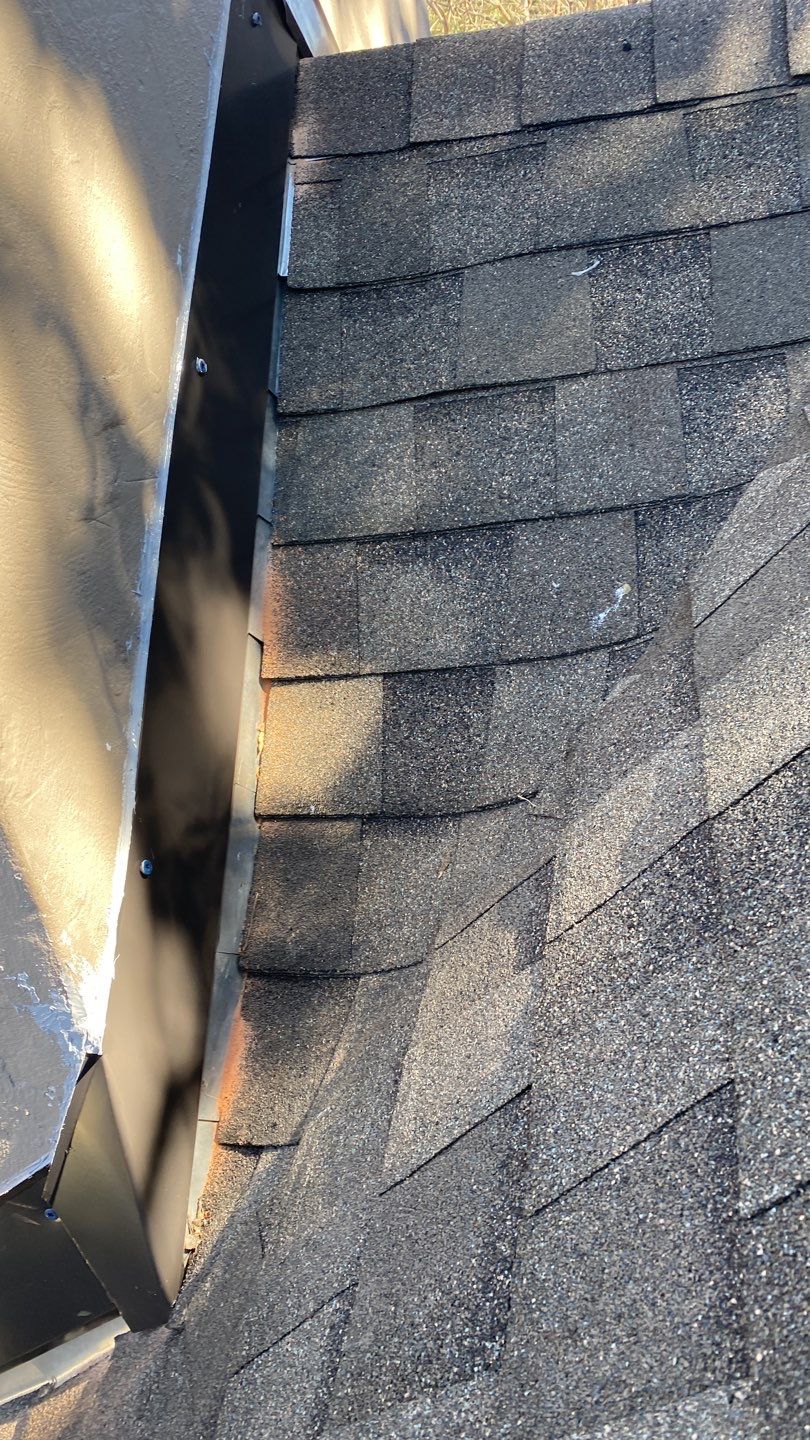 New chimney flashing and counterflashing installed during roof leak repair in Dallas 75206
