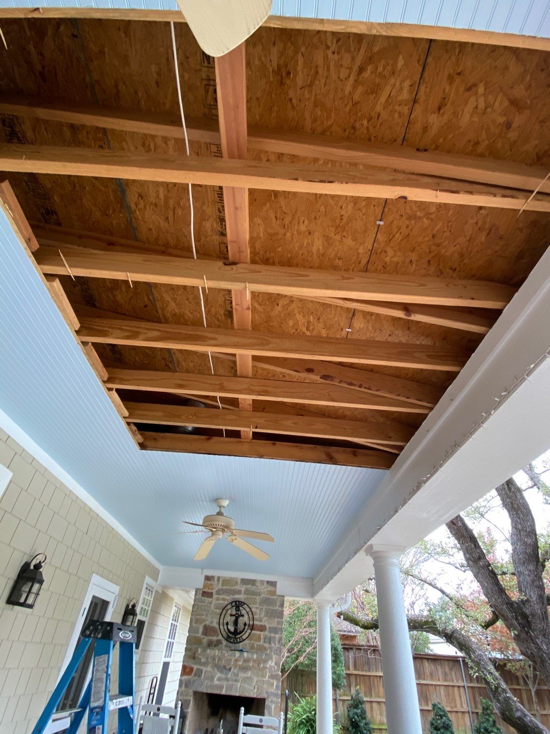 Back porch soffit and rafter repairs during North Dallas roof project