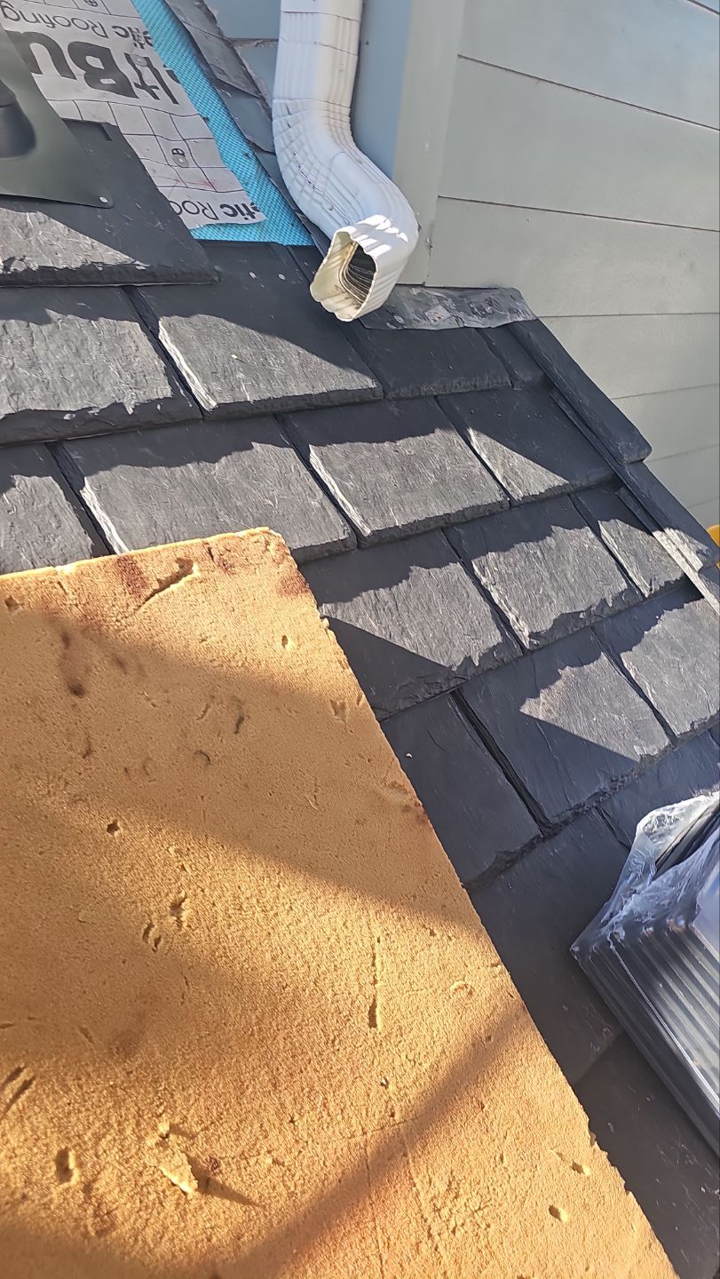 Installing individual DaVinci Province Slate tiles on a University Park roof
