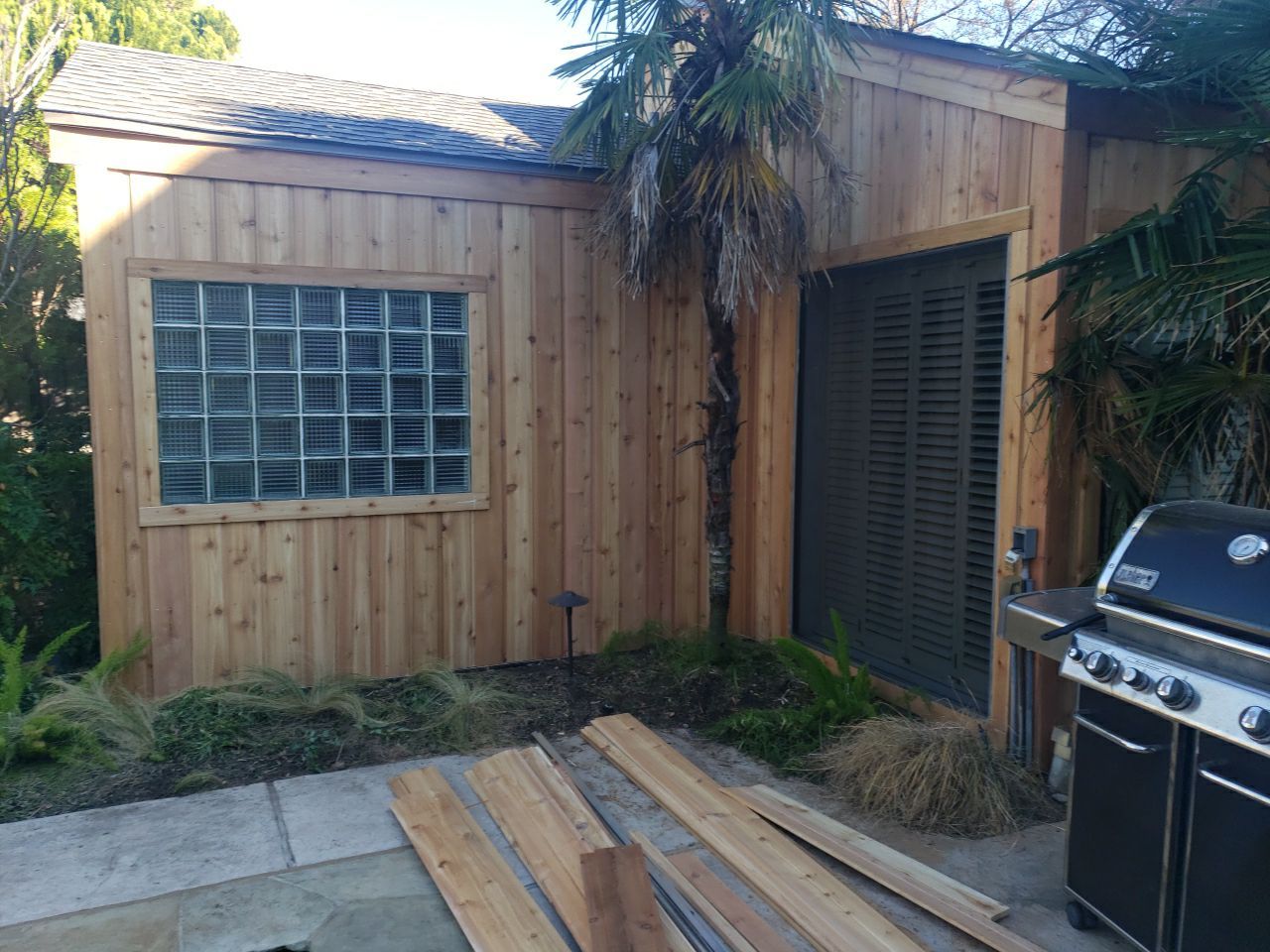 New cedar siding installed on the rear of a Lake Highlands home in Dallas 75231 after storm damage.