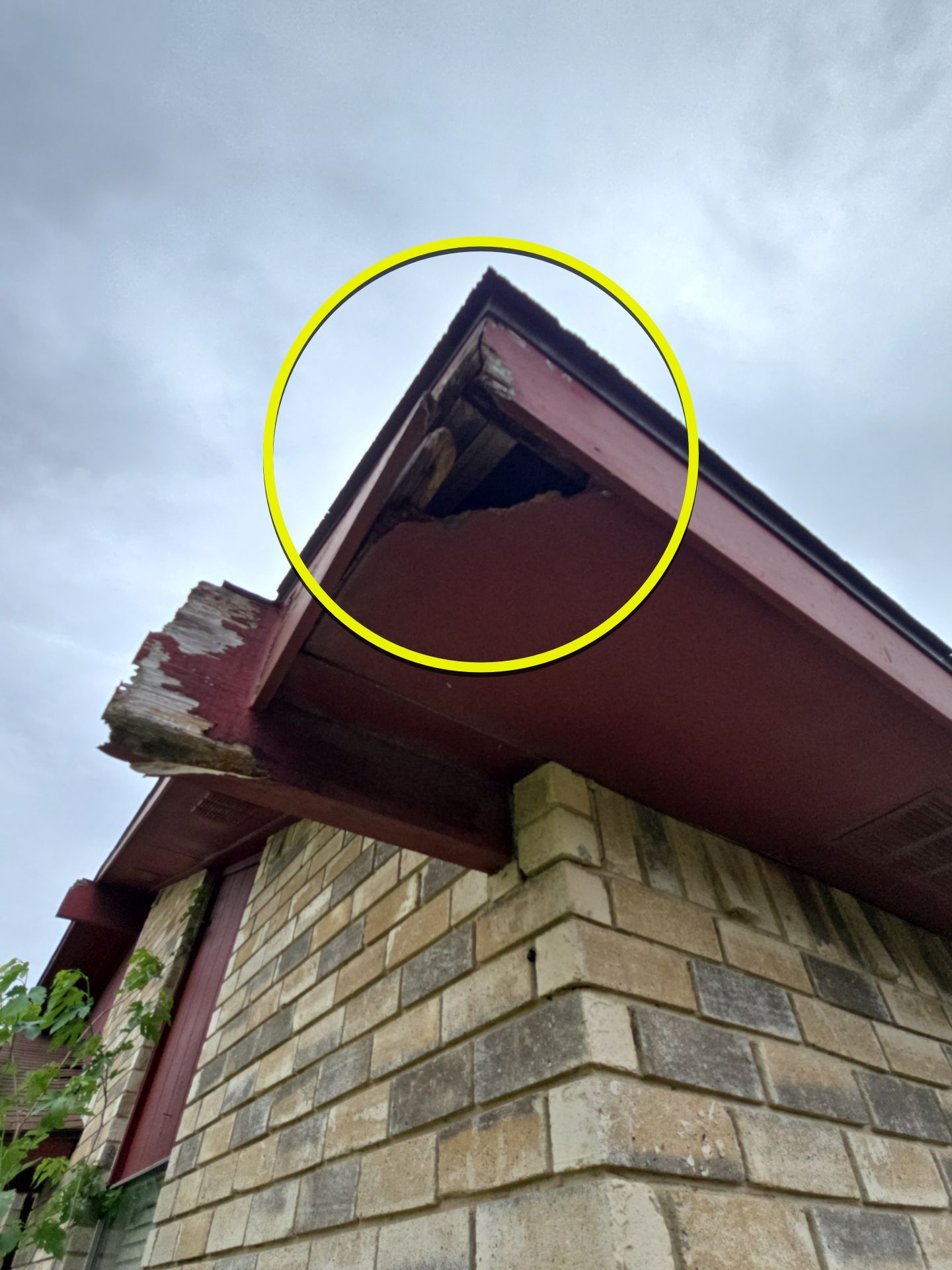 Deteriorated fascia and soffit on Garland home before roof and carpentry repairs