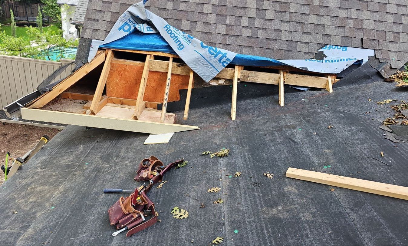 First supporting photo: Photo 4, page 4 of the Woodland 2 report. It is one of the sharper images and shows the new construction physically tying into the existing roof.   Place it immediately after the opening section, after this sentence:  > “This became a good example of the type of substantial roof repair and modification work we handle in Preston Hollow and throughout Dallas.”  That gives the reader a visual of what “roof modification” actually meant before you move into the shingle-matching New porch addition being tied into an existing roof during a Preston Hollow roofing project