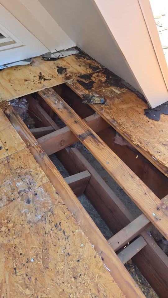 Localized rotten roof decking exposed during a roof replacement in Dallas 75214
