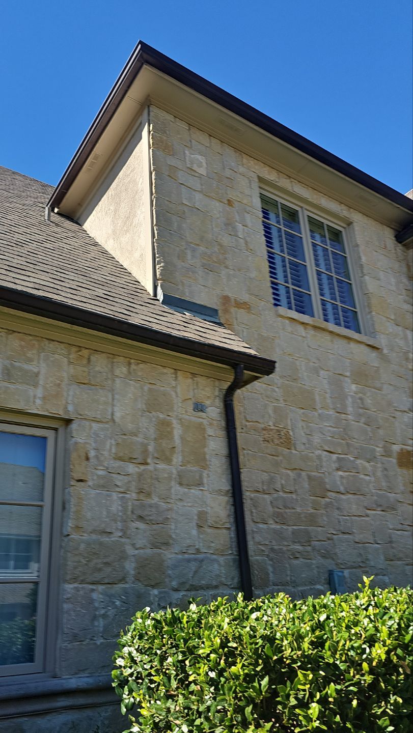 Original copper gutters reinstalled beneath the new Owens Corning Duration Storm roof on a Preston Hollow home in Dallas.