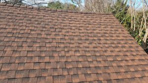 Close view of GAF Timberline HDZ architectural shingles in Hickory installed on a recent East Dallas roof replacement.